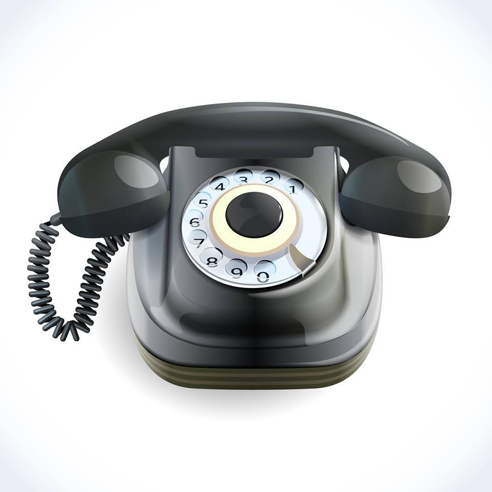Na zdjęciu czarny telefon stacjonarny.