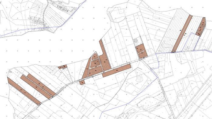Grafika przedstawia fragment mapy ewidencyjnej z zaznaczonym obszarem objętym planem miejscowym. Widoczne są granice działek, układ dróg oraz tereny wyróżnione kolorem brązowym, które oznaczają obszar przeznaczony pod określoną funkcję w planie zagospodarowania przestrzennego. Na mapie zaznaczono również linie rozgraniczające oraz elementy infrastruktury, a także granice opracowania.